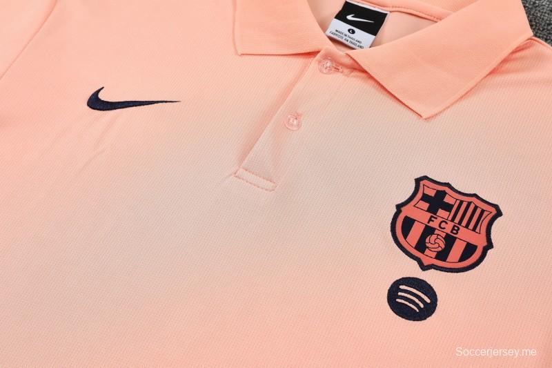 26/27  قميص بولو للتدريب بلون السلمون الوردي من برشلونة + بنطال طويل بلون أزرق داكن - بدلة رياضية