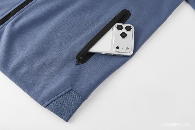 26/27  طقم رياضي من باريس سان جيرمان باللون الأزرق الفولاذي مع سترة بغطاء رأس وسحاب كامل + بنطال طويل