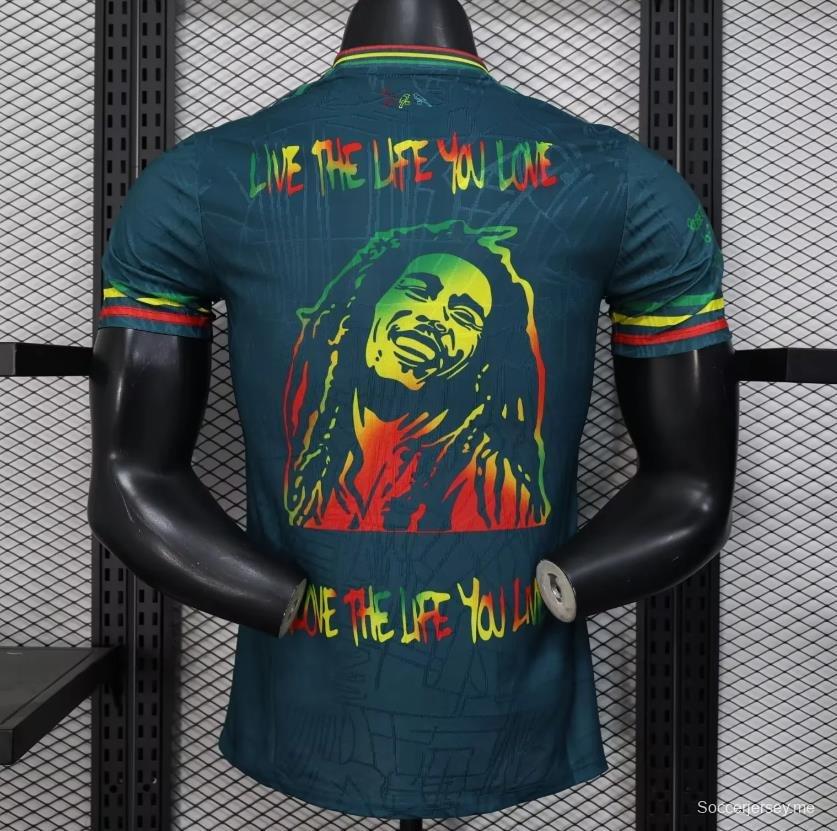 قميص أجاكس 25/26 أزرق داكن مع قميص بوب مارلي التذكاري